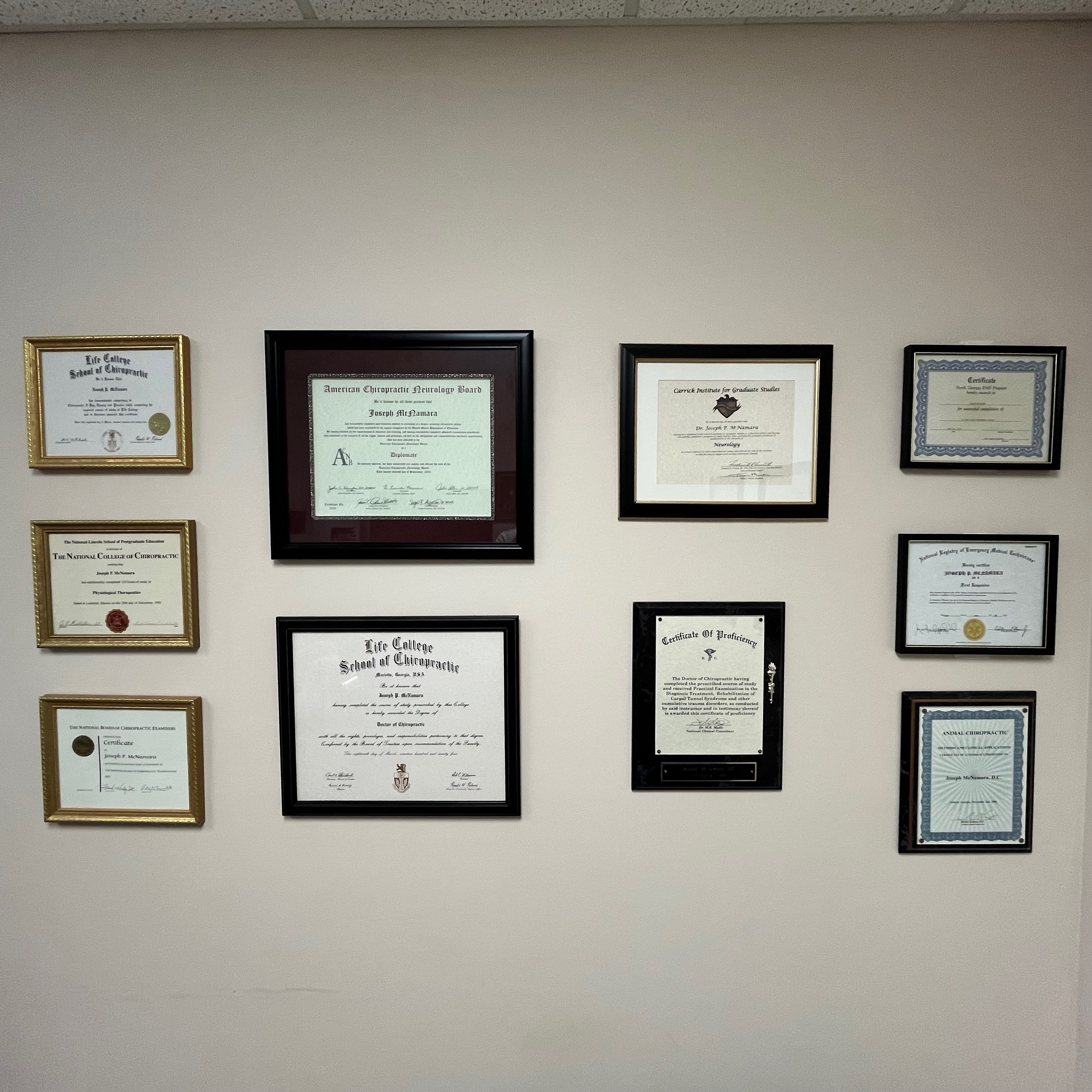 Dr. McNamara's wall of credentials, certifications, and awards